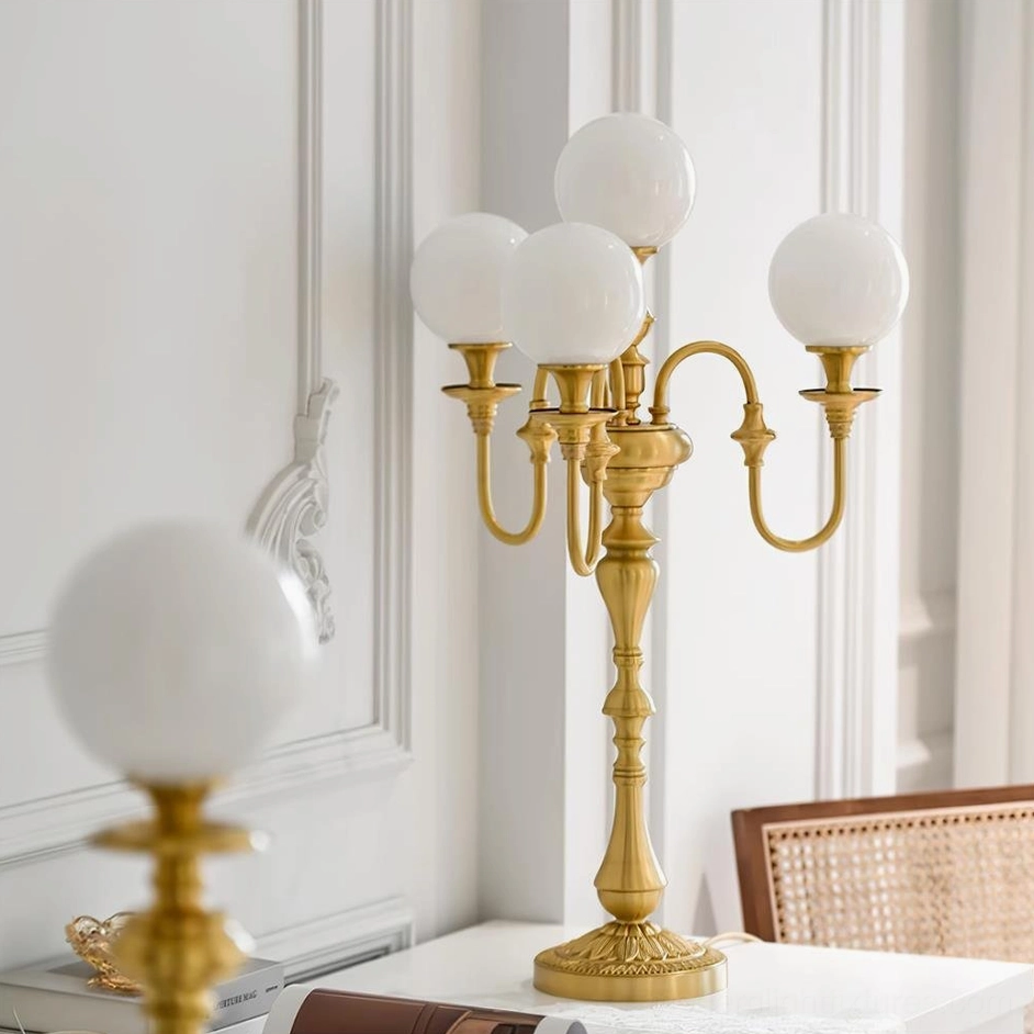 Brass table lamp architectural detail showing G9 socket and push-button switch mechanism