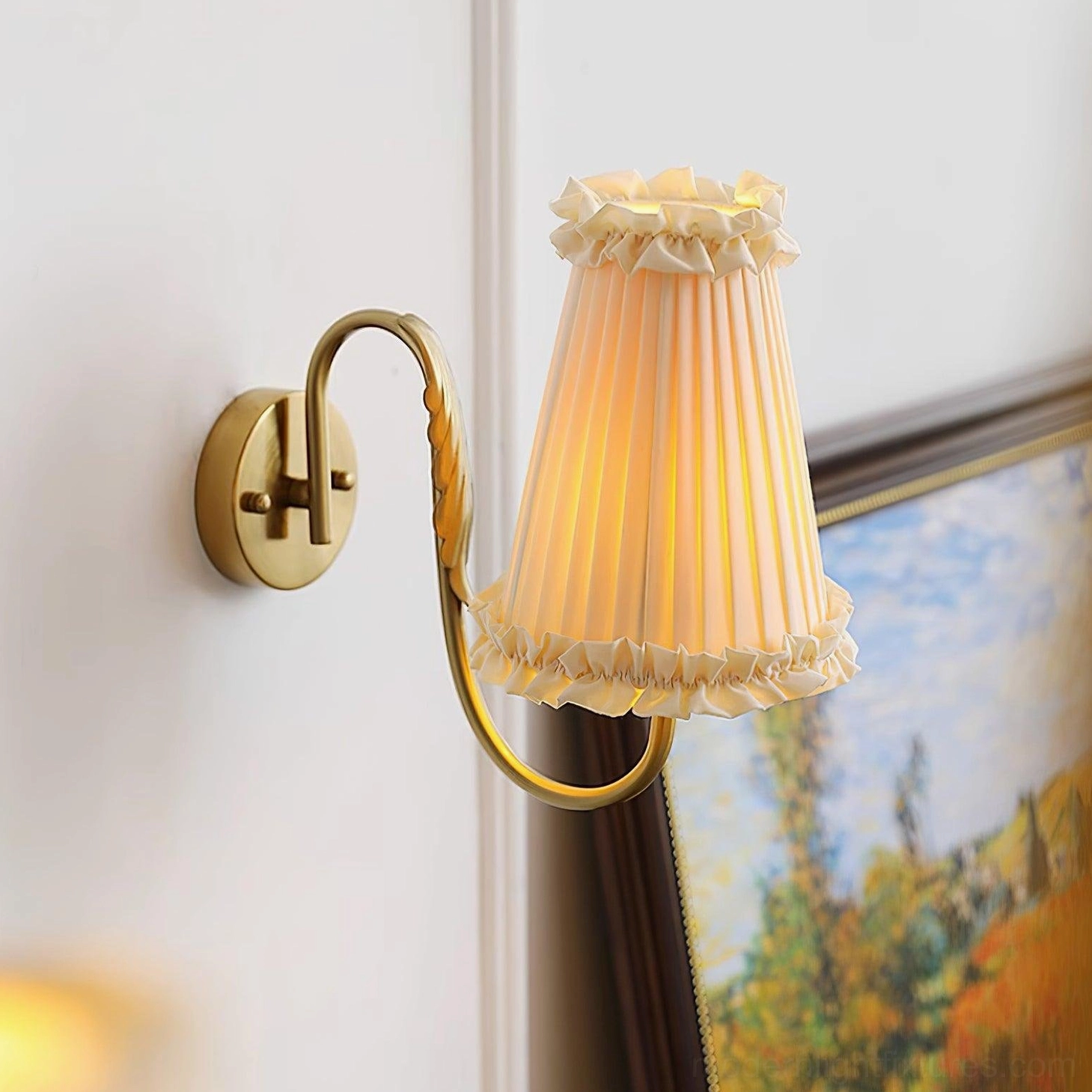 Brass wall sconce curved arm design architectural detail product shot