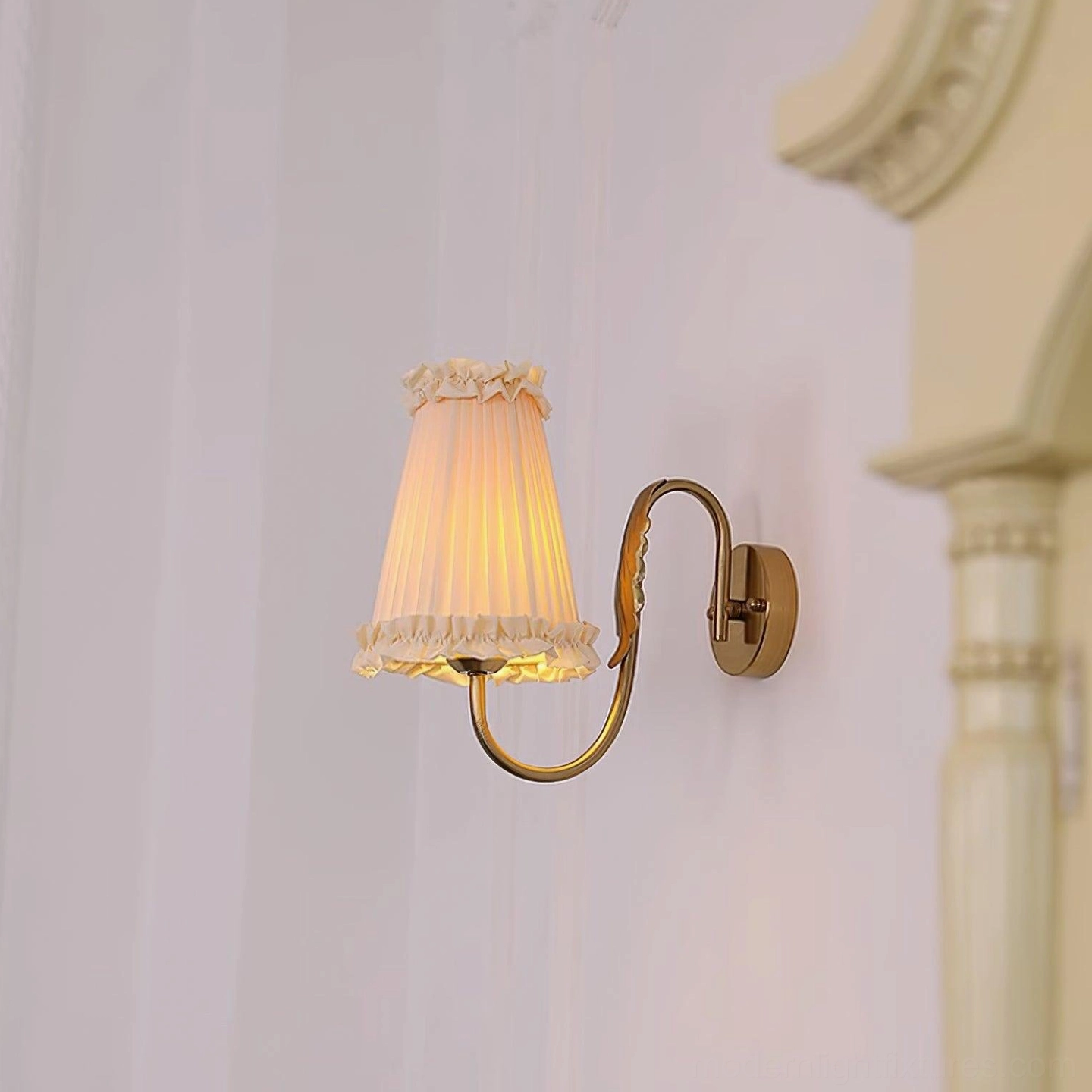 Multiple brass wall sconce fixtures arranged interior design styling