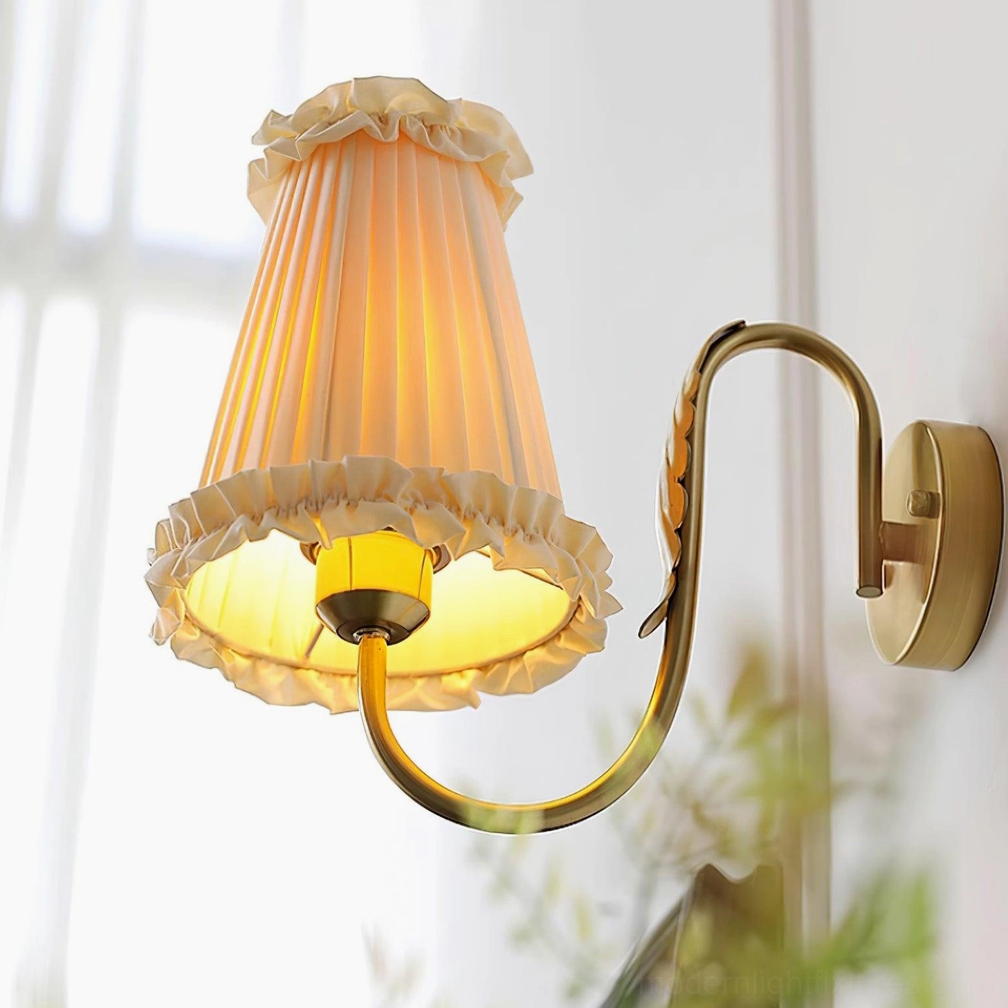 Brass wall sconce pleated fabric shade texture and ruffled edge detail