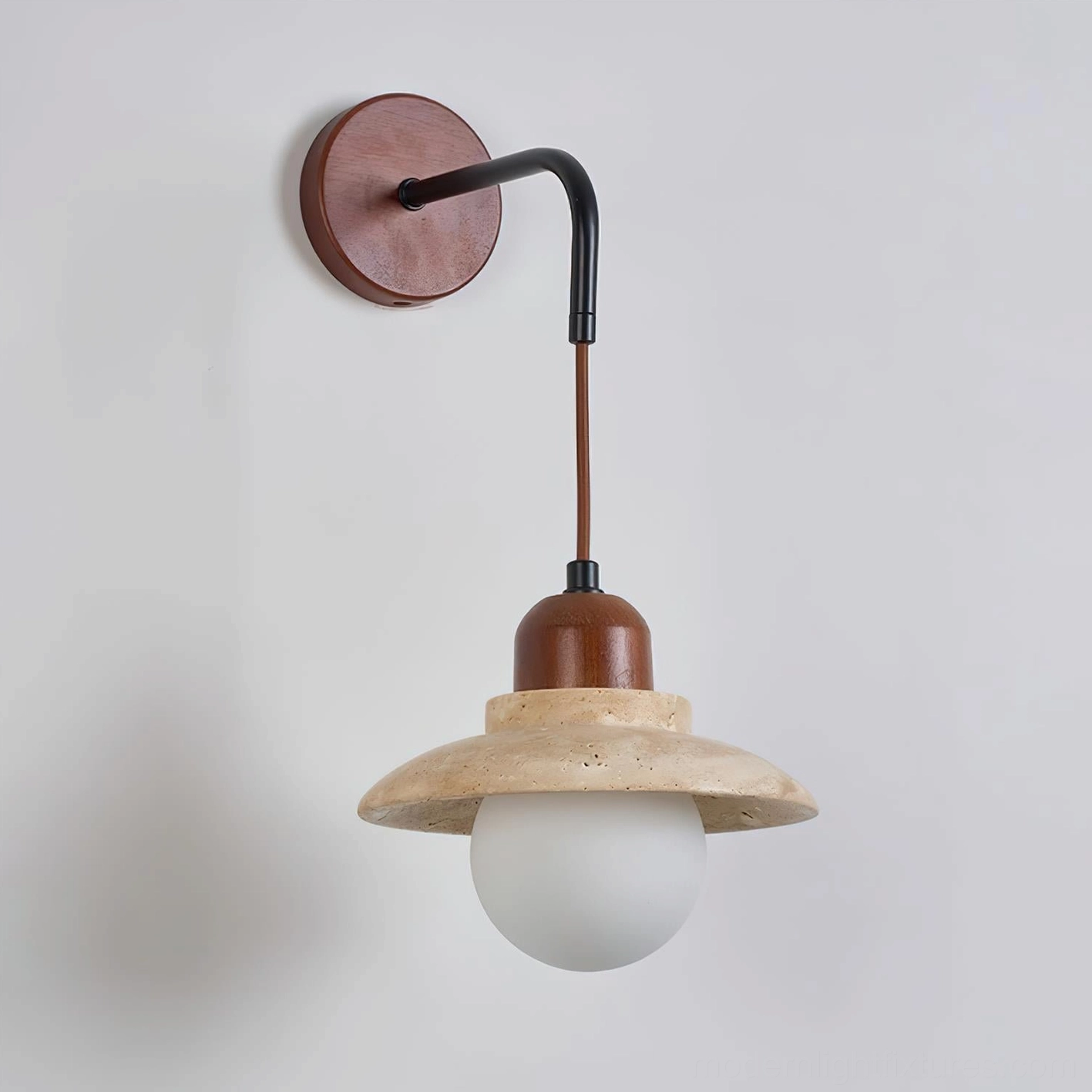 Brava travertine dome shade close-up showing natural stone texture and frosted opal glass diffuser