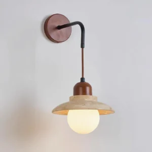 Brava natural stone sconce side profile displaying curved black metal arm and walnut wood wall mount detail