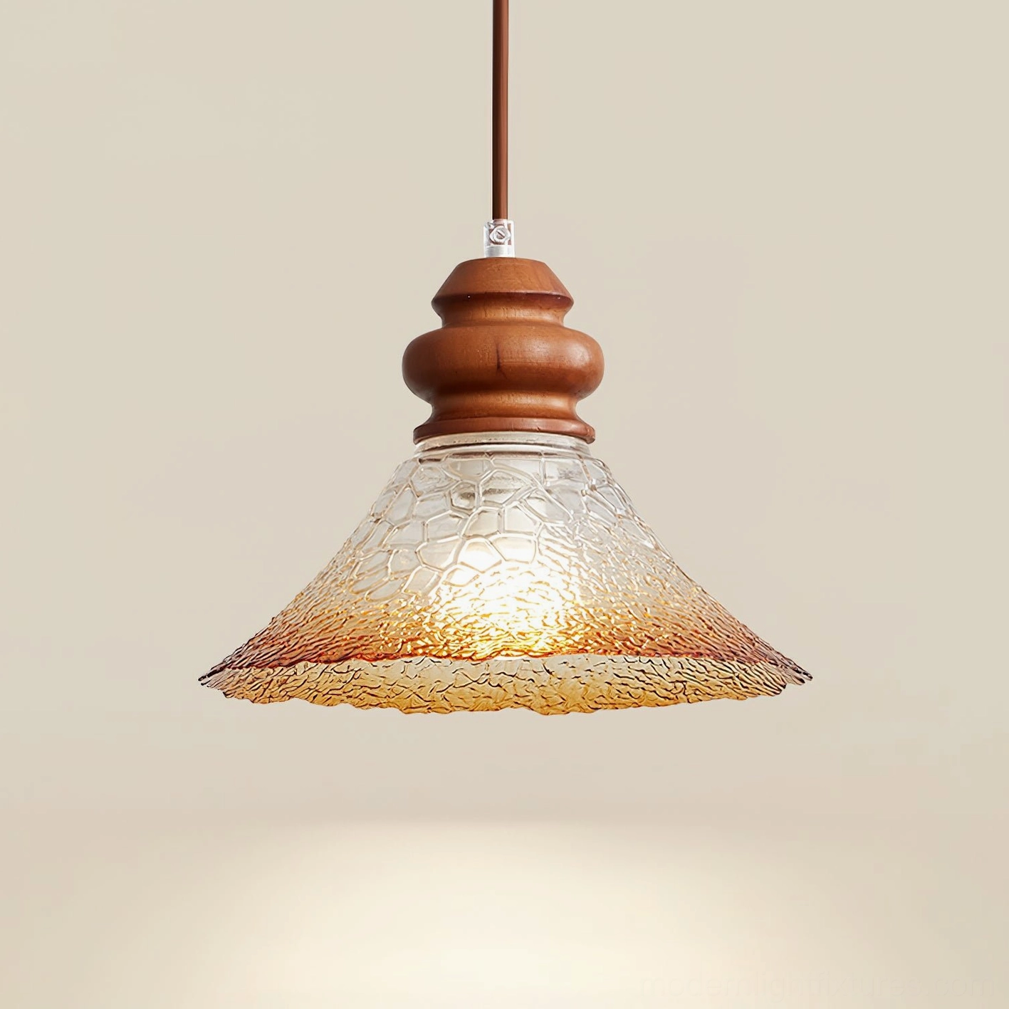 Brenna modern pendant fixture with gradient amber textured glass shade and wood hardware, illuminated