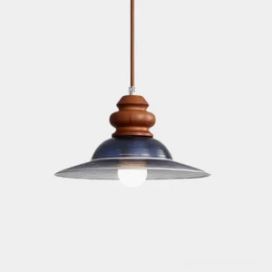 Brenna modern pendant light with deep blue glass shade and walnut wood mount, close-up overhead view