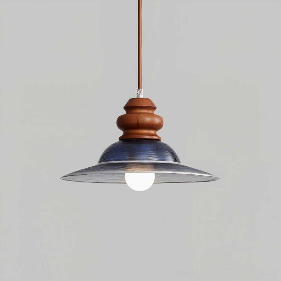 Brenna pendant light Model A with deep blue glass shade, overhead studio lighting view