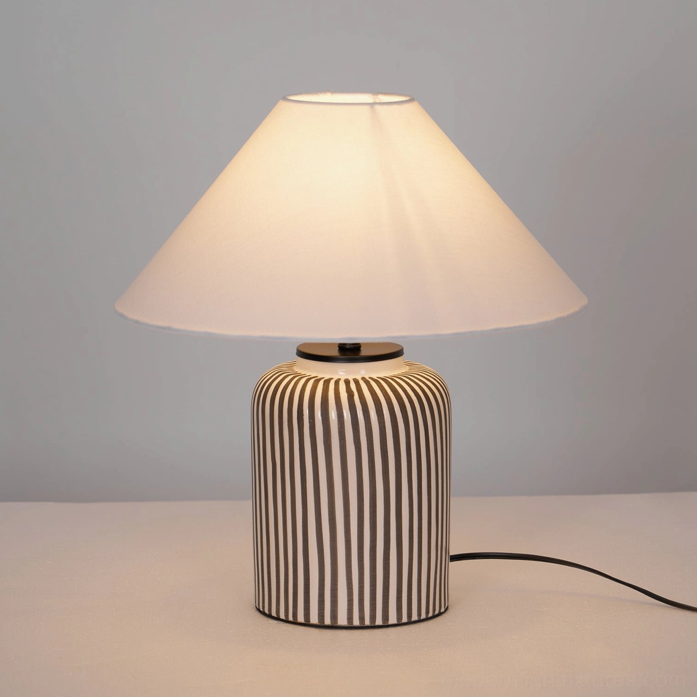 Hand-painted striped ceramic table lamp base with premium neutral fabric shade and push-button switch
