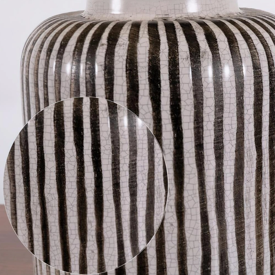Brenton striped ceramic table lamp in transitional interior design setting with traditional furniture