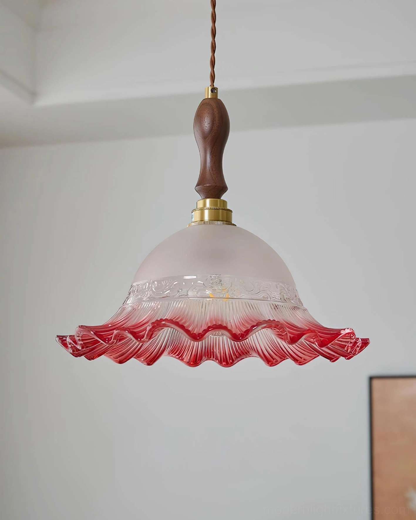 Brielle three-head linear pendant fixture installed over dining area or kitchen island