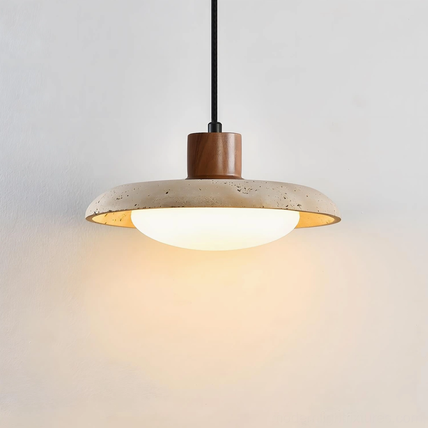 Single travertine pendant light in warm white 3000K color temperature showing light diffusion quality