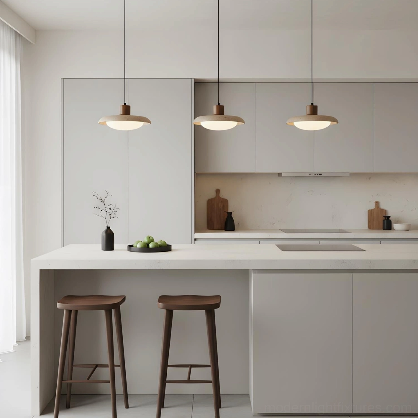 Triple travertine pendant lights hanging above modern kitchen island, contemporary minimalist dining area
