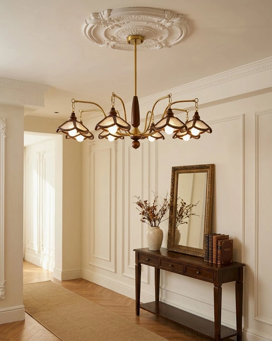 Brindlea wood and brass vintage chandelier detail shot showing turned wood column and curved brass-tone arms with amber acrylic shades