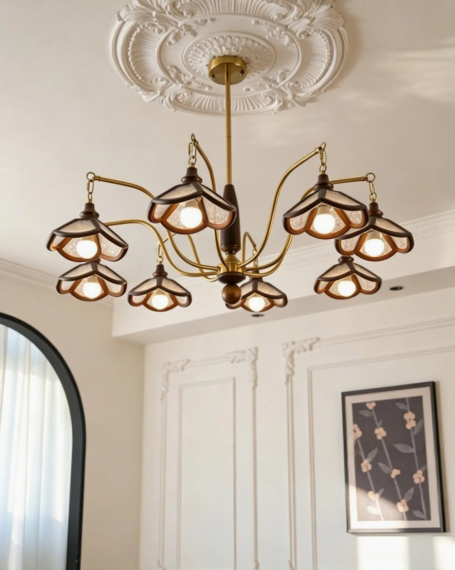 Vintage pendant chandelier with wood-rimmed amber shades and brass-tone arms installed in small dining nook, close-up view