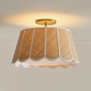 Brinelle raffia drum shade flush mount with six white ribbon panels creating scalloped sections and wavy lower edge detail, front studio close-up