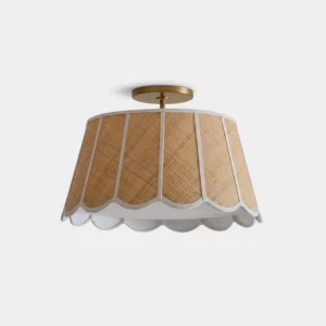 Brinelle hand-woven natural raffia flush mount ceiling light with scalloped white ribbon trim and warm gold metal canopy, overhead studio view isolated on white background
