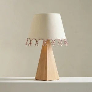 Brinelle table lamp with beige fabric shade and looped trim detail, walnut wood base