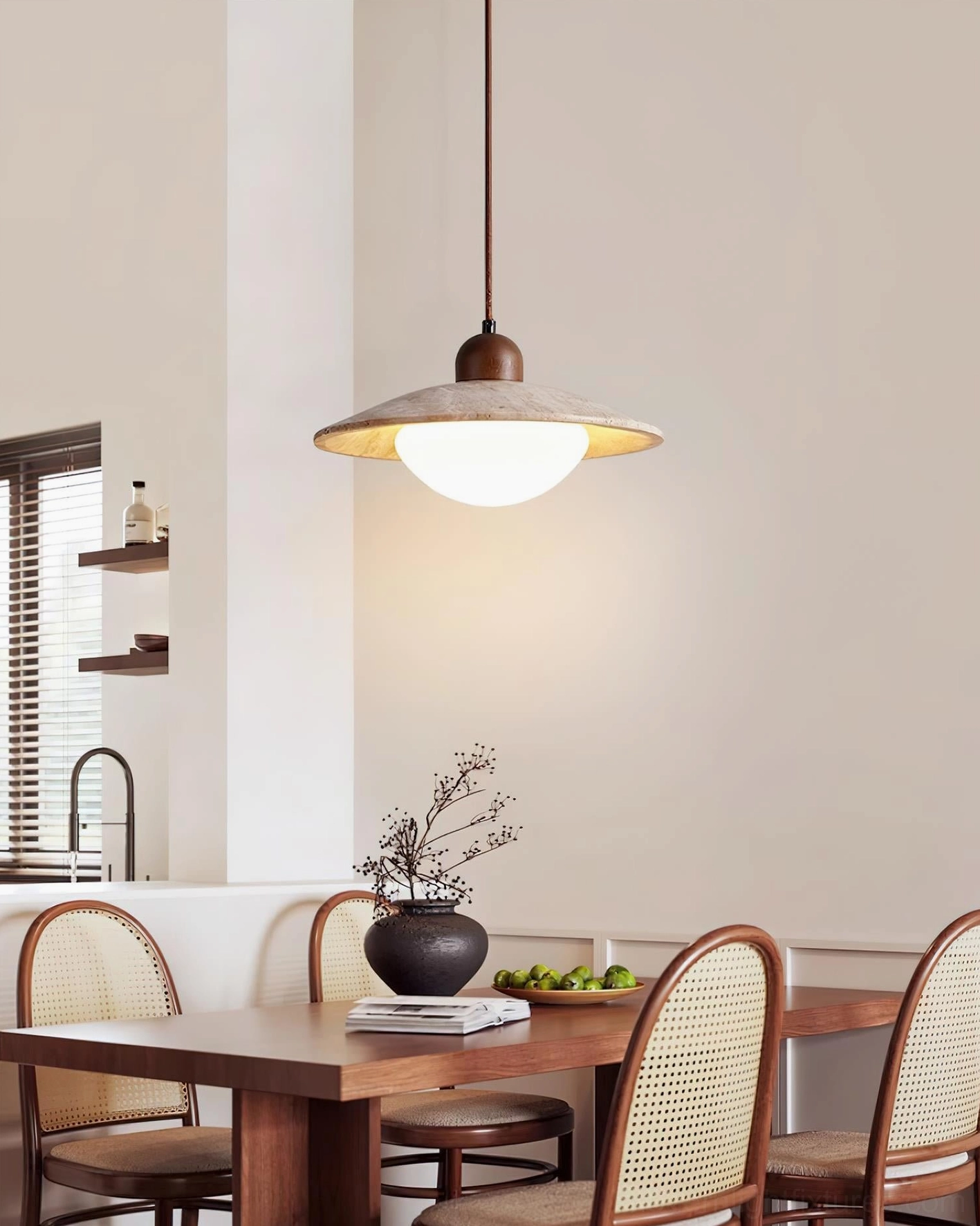Side view of Brio rustic pendant light above wooden dining set
