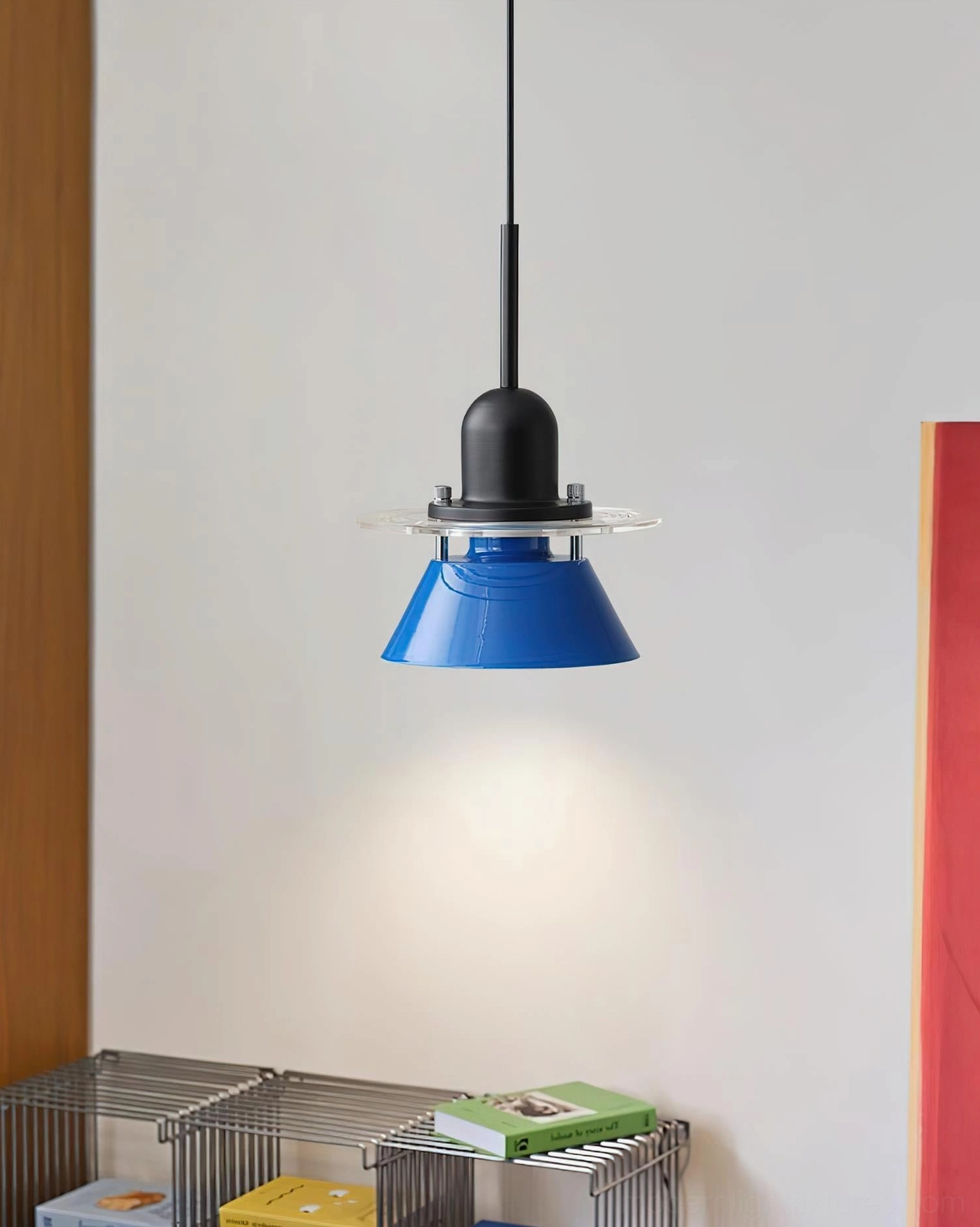 Contemporary blue pendant lamp with black suspension hardware on metal shelf interior background