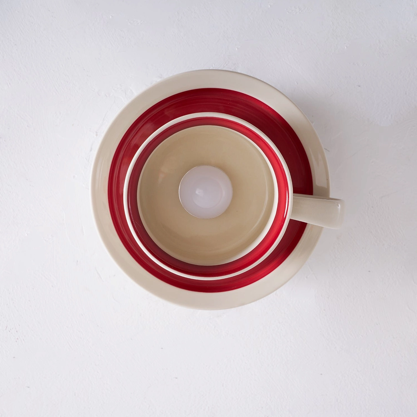 Brisa ceramic tea cup ceiling light in interior room setting demonstrating installation and ambient lighting effect
