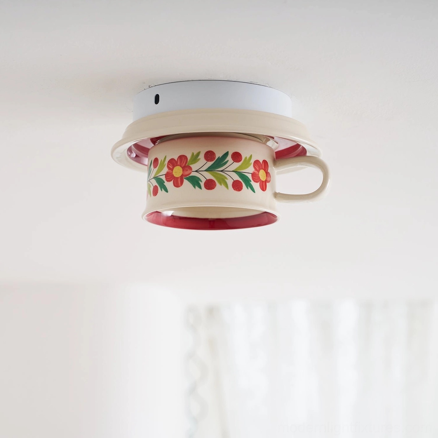 Brisa hand-painted ceramic tea cup ceiling light fixture detail view showcasing floral artistry and glazed finish