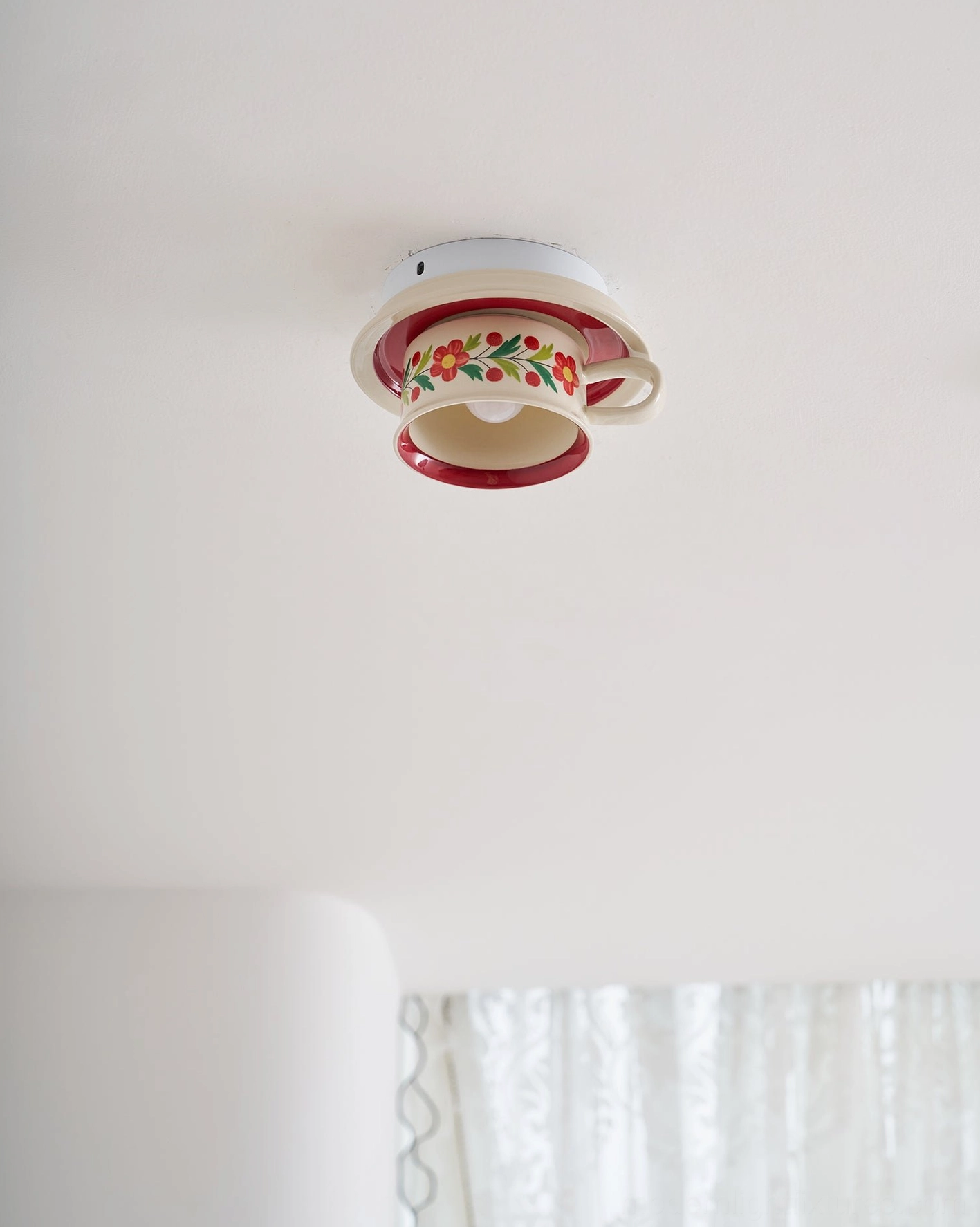 Brisa ceramic tea cup ceiling light three-quarter view highlighting sculptural silhouette and artisanal craftsmanship