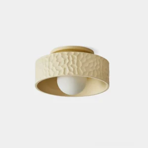 Brito pebble-textured flush mount ceiling light in cream white, modern minimalist design front view