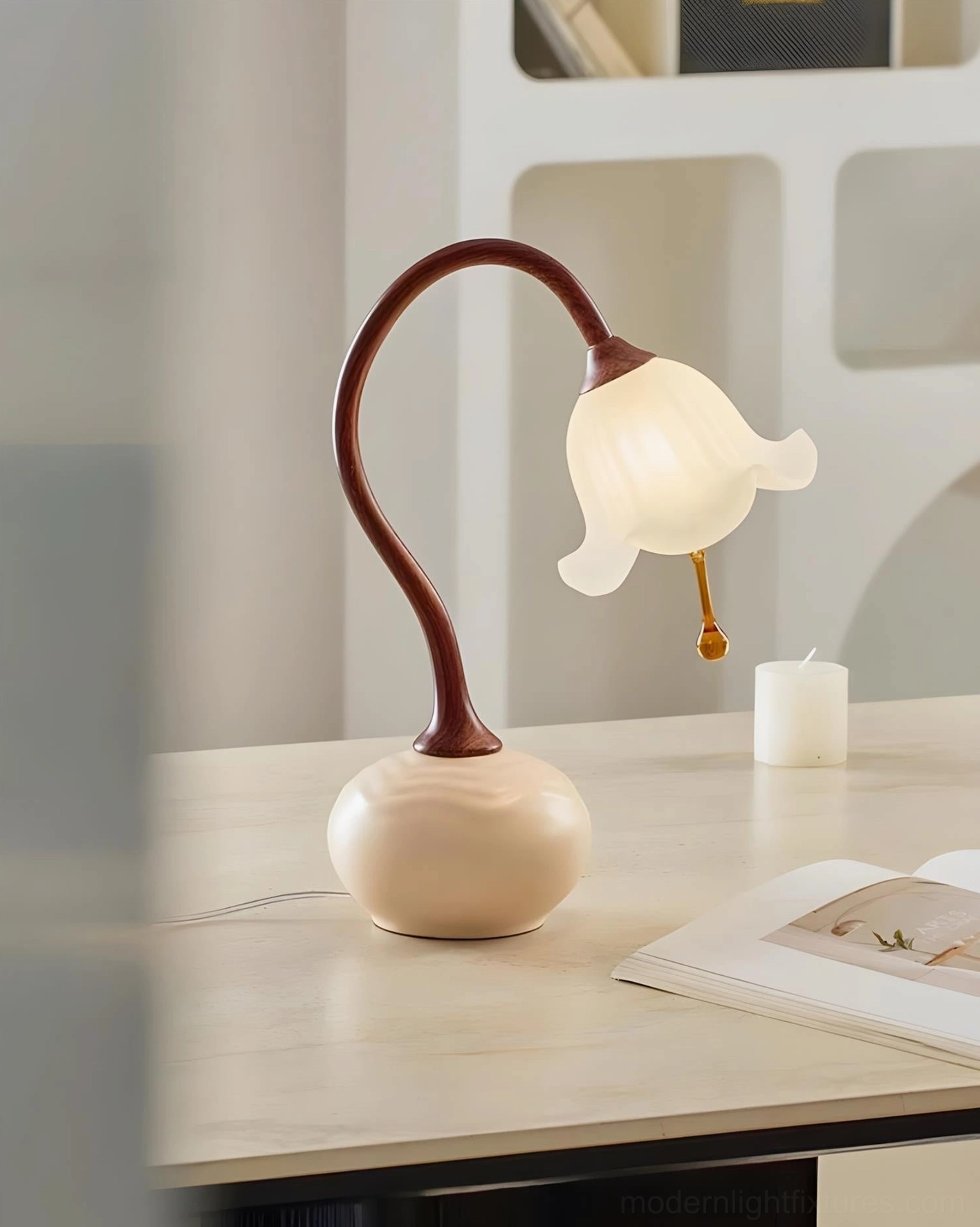 Brivana lamp soft-focused product shot with magazine and candle - cozy minimalist ambient lighting
