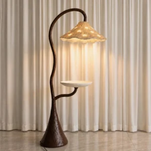 Brivora floor lamp three-quarter angle with textured brown resin base and hand-finished cream composite shade, product detail view