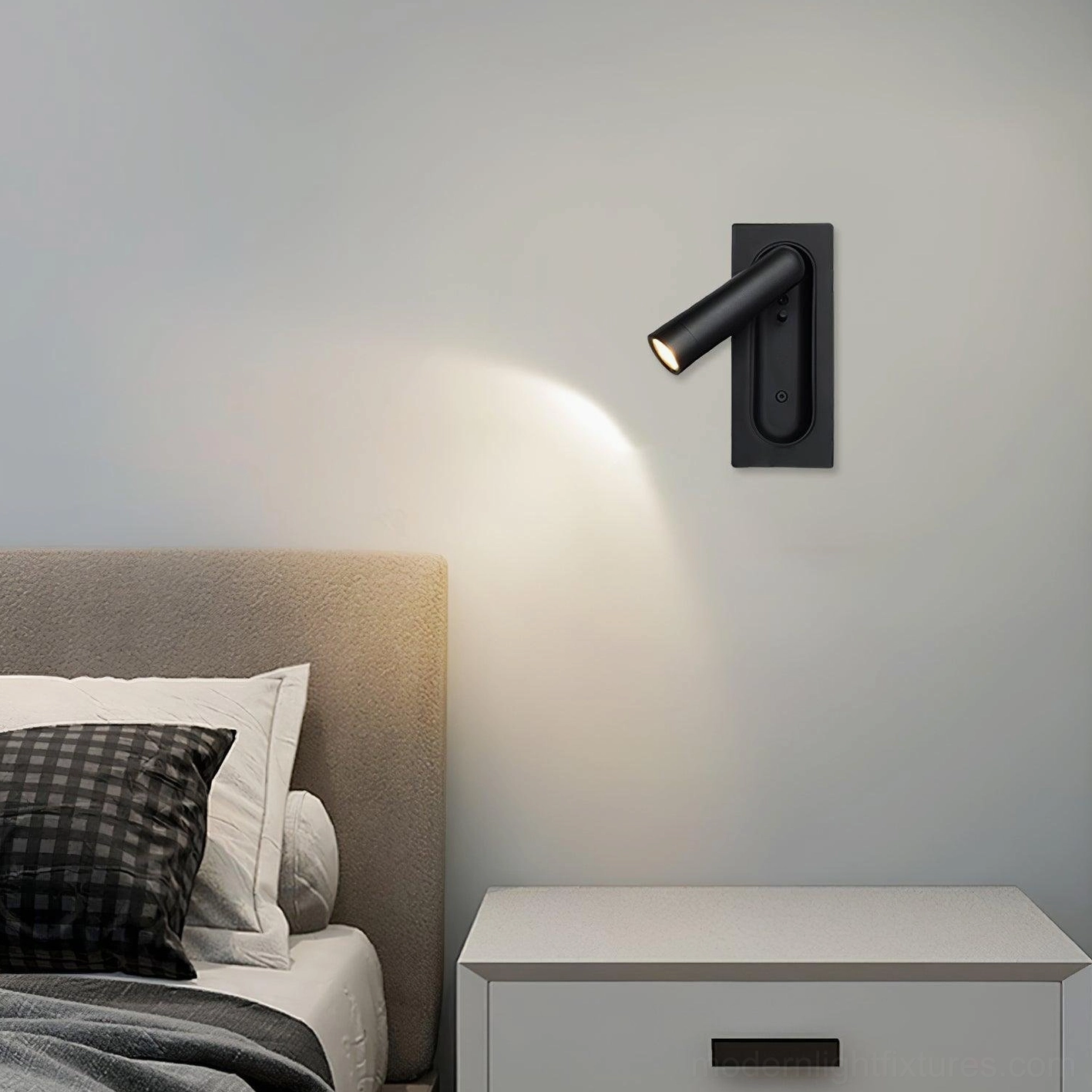 Bronze finish 360-degree rotatable wall lamp providing warm directional lighting in contemporary bedroom setting