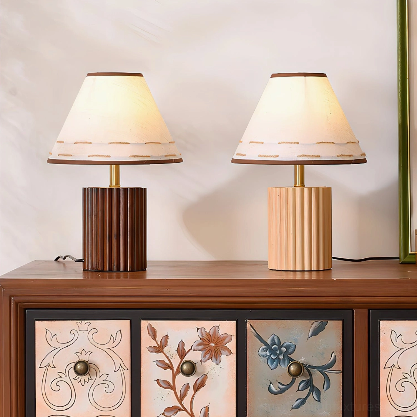 Two Brooke wooden table lamps paired together, one light wood and one walnut finish, on retro wooden dresser