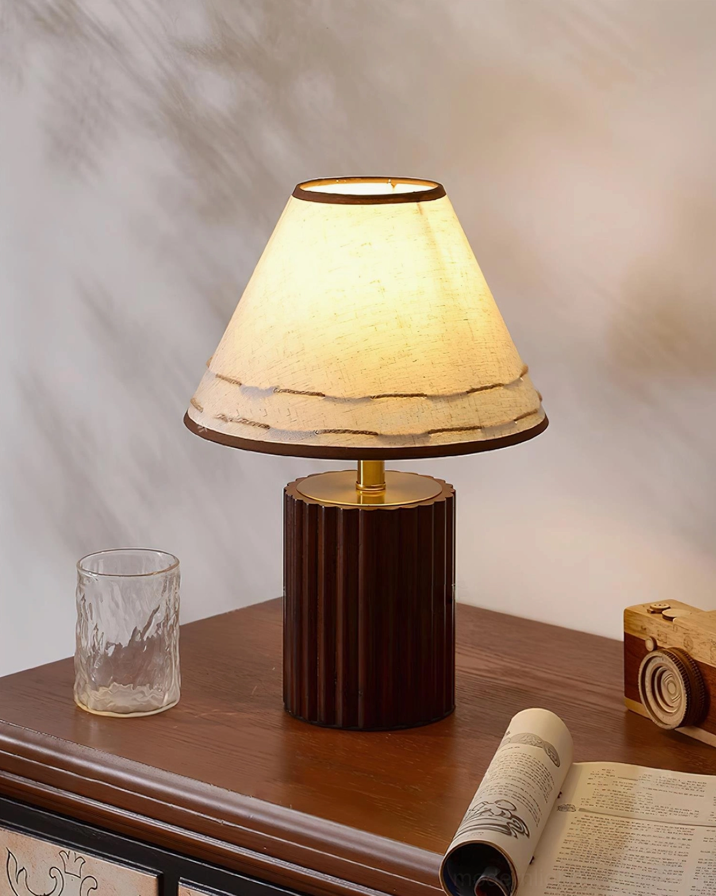 Close-up detail of Brooke wooden table lamp showing fabric shade stitching, brass metal rod, and tapered construction