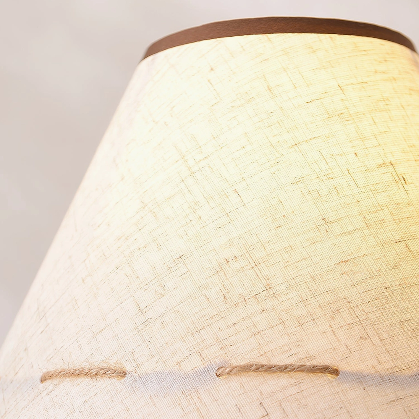 Brooke wooden table lamp with dark walnut base providing soft diffused light on wooden furniture setting