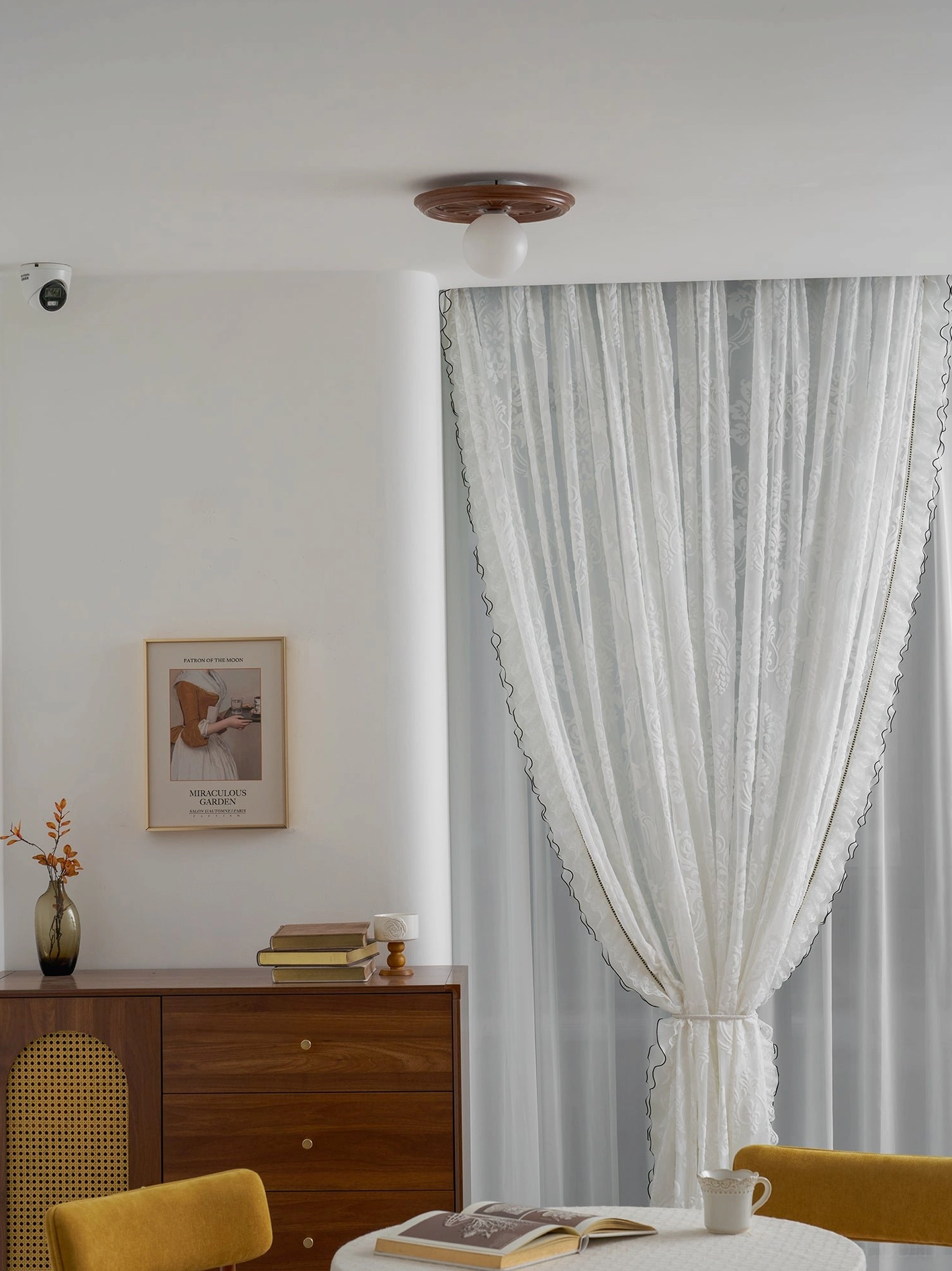 Brown carved resin ceiling light installed in contemporary transitional interior