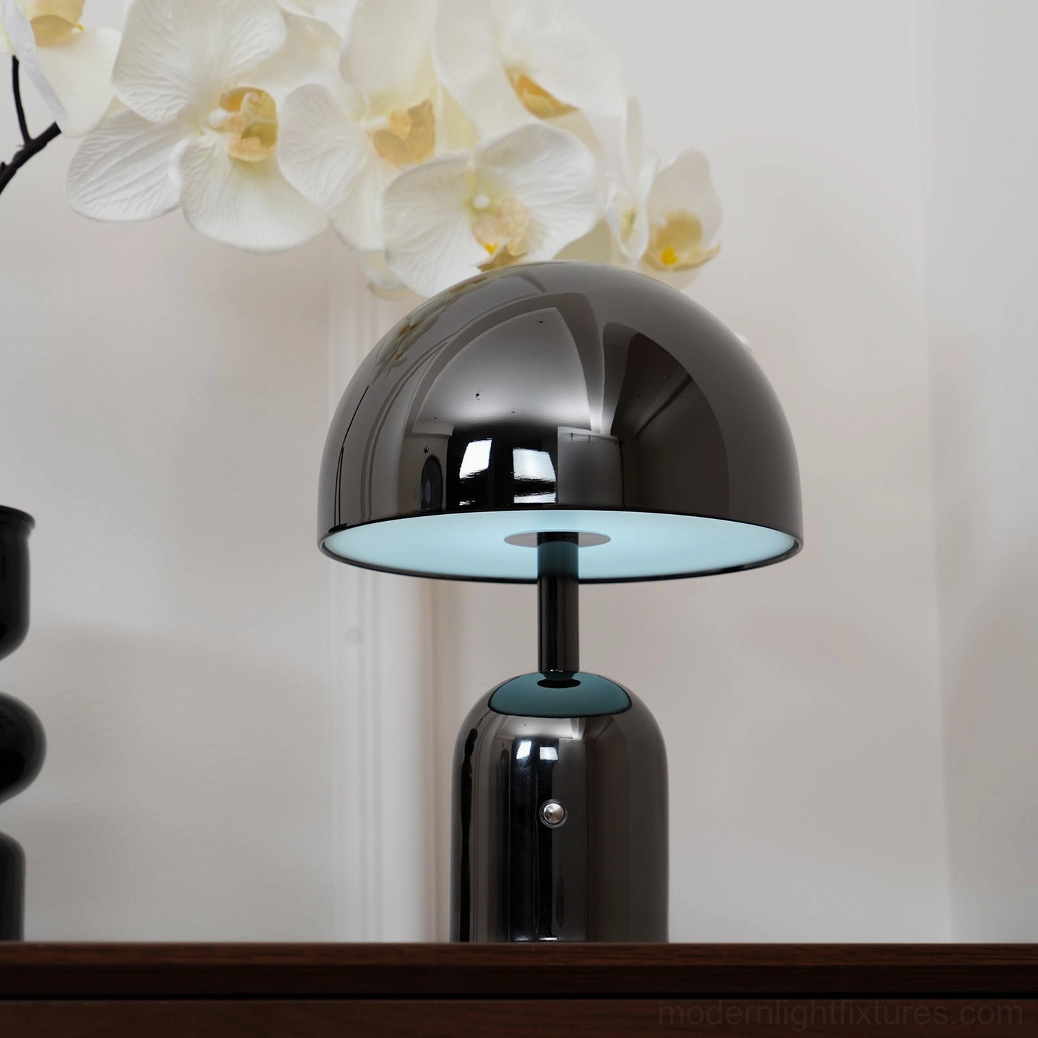 Chrome Brulee table lamp detail showing smooth metallic curves and refined dome silhouette