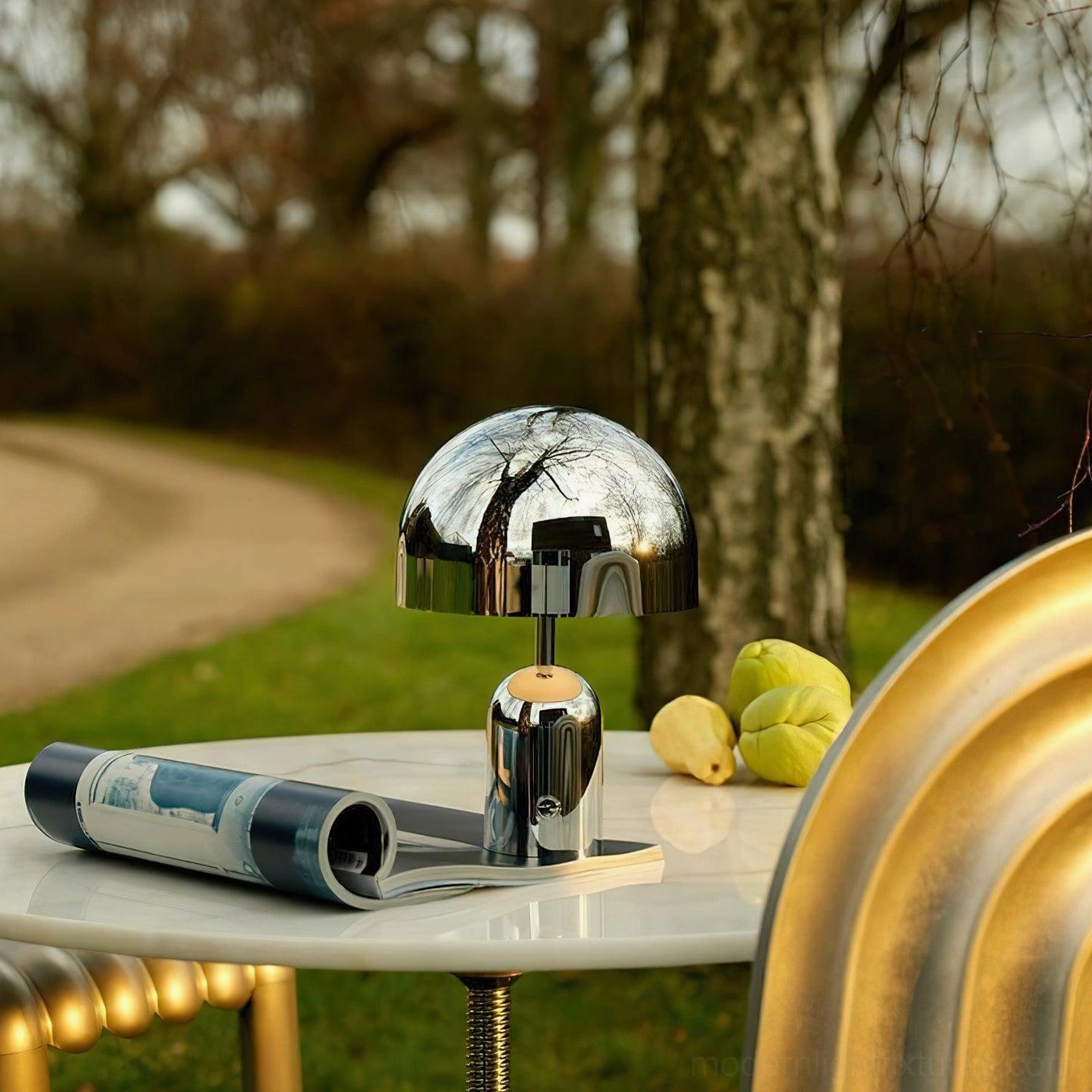 Brulee table lamp in chrome finish complementing mid-century modern interior design aesthetic