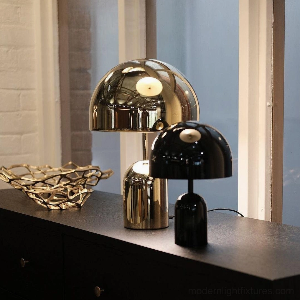 Gold Brulee portable lamp illuminating reading materials on bedside table with warm soft light