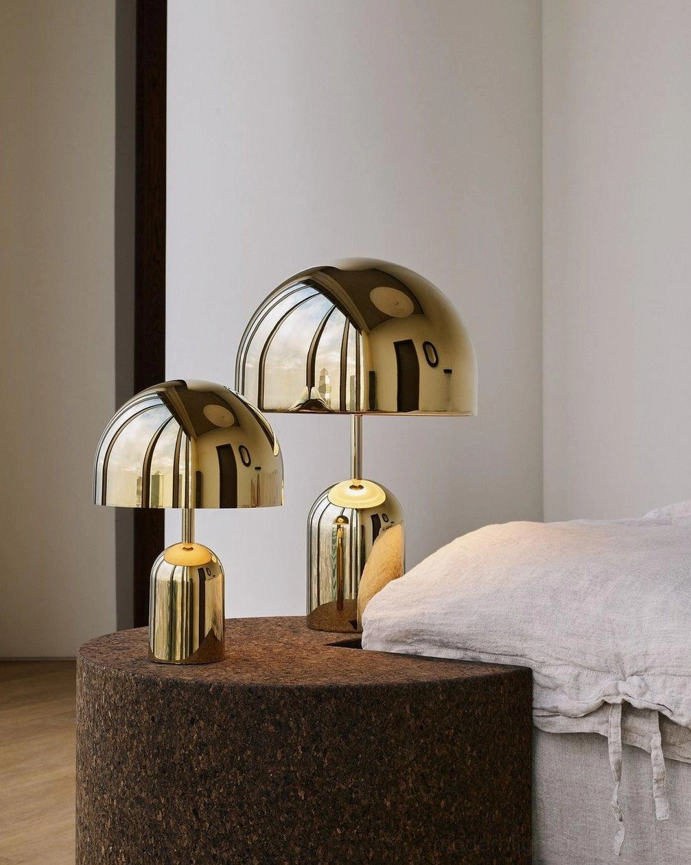 Rose gold Brulee portable table lamp adding sophisticated accent lighting to modern furniture grouping