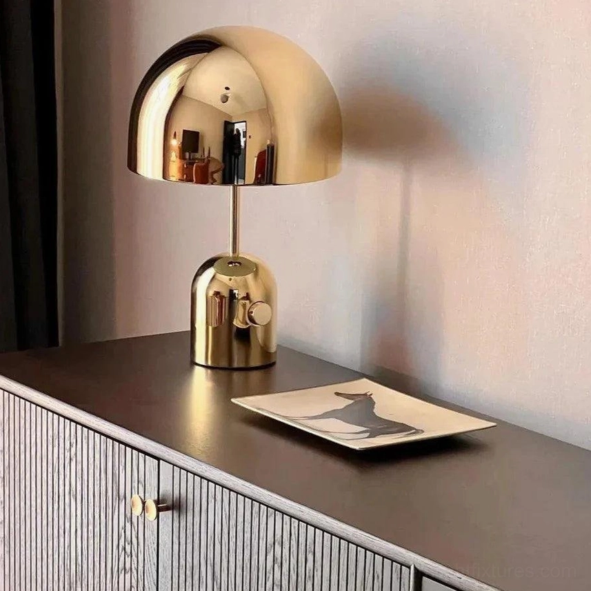 Rose gold Brulee portable table lamp creating luxurious ambient glow in contemporary bedroom