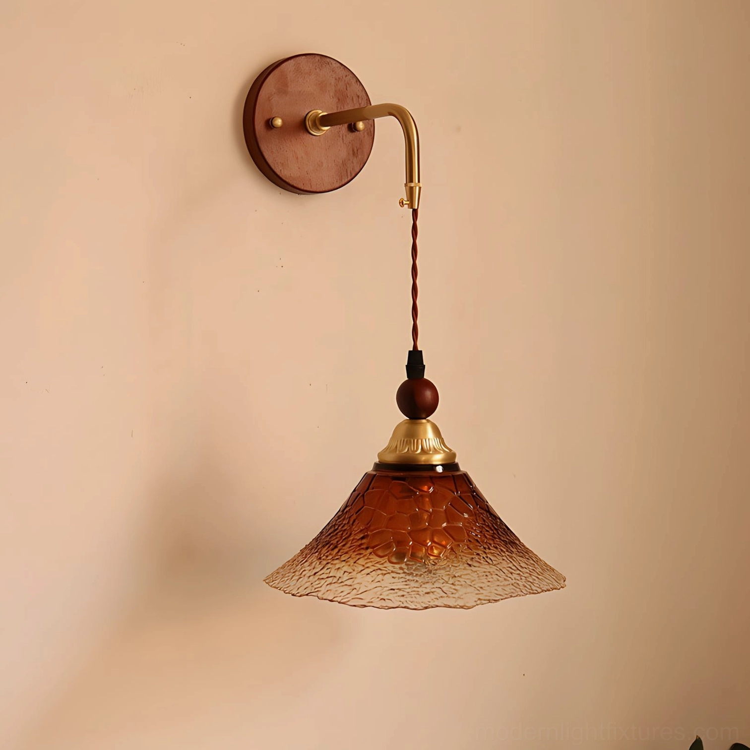 Bruma pendant-style wall lamp with twisted fabric cord and brass hardware close-up