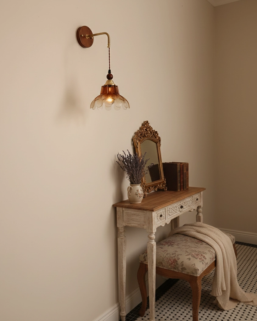 Bruma vintage wall sconce above vanity table with ornate mirror in bedroom corner