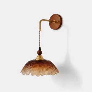 Bruma vintage brass wall sconce with gradient amber ruffled glass shade - front studio product view