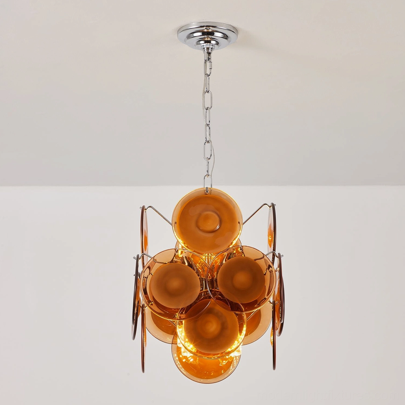 Brunelle disc glass pendant chandelier showcasing design details and sculptural qualities of polished glass shades