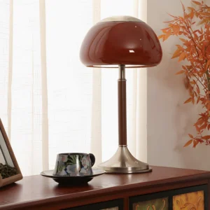 Brunello table lamp styled on wooden side table with home decor accessories and warm ambient lighting in living space