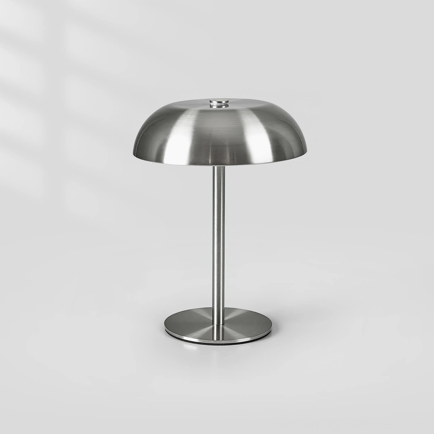 Brushed silver metal Crescent table lamp with smooth finish and classic minimalist silhouette