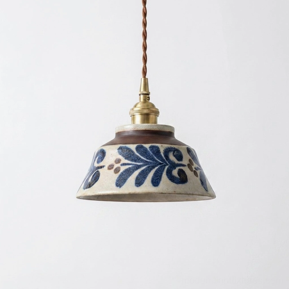 Brushstroke hand-painted ceramic pendant lamp showing indigo blue artistic glaze on warm cream base with brown rim