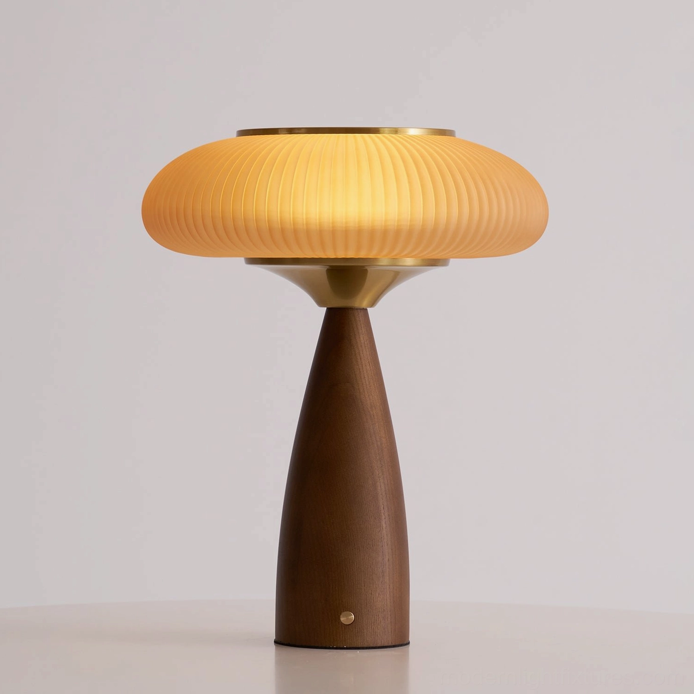 Brynn rechargeable cordless table lamp 30cm diameter 38cm height walnut color with amber ribbed glass shade and USB charging port
