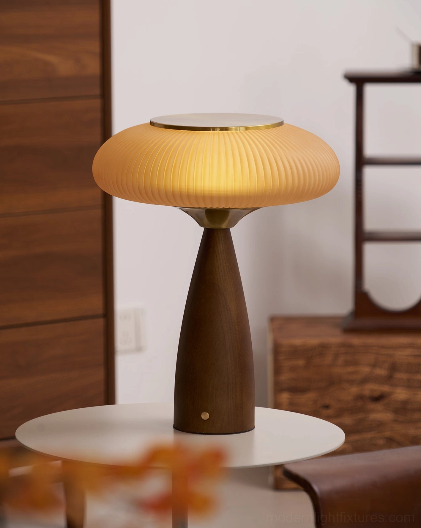 Brynn rechargeable lamp on round side table, retro interior decor with floral elements, three-quarter right front view