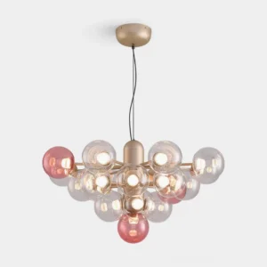 Modern bubble glass chandelier with clear and pink glass spheres in gold metal frame, close-up studio view