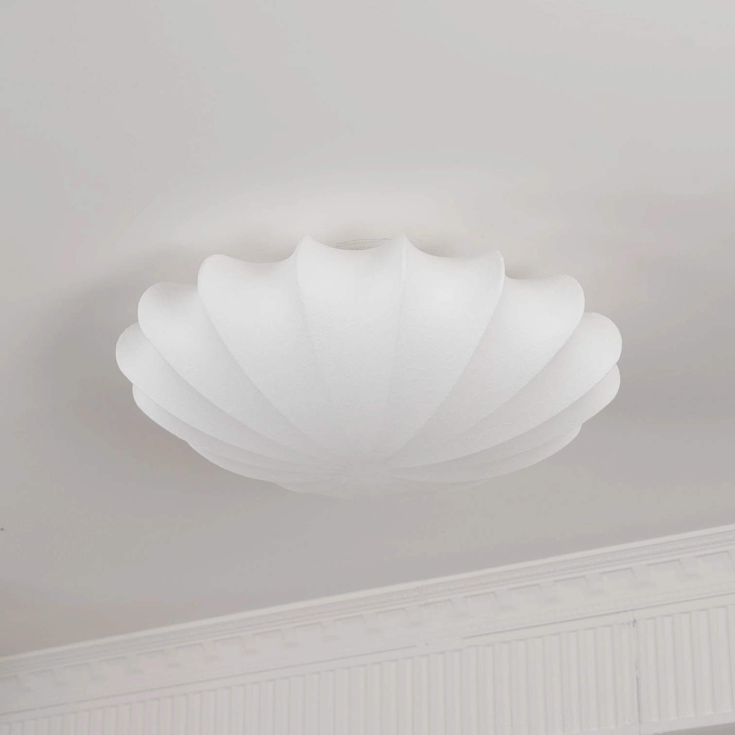 Contemporary bubble light in transitional interior design style blending traditional and modern elements