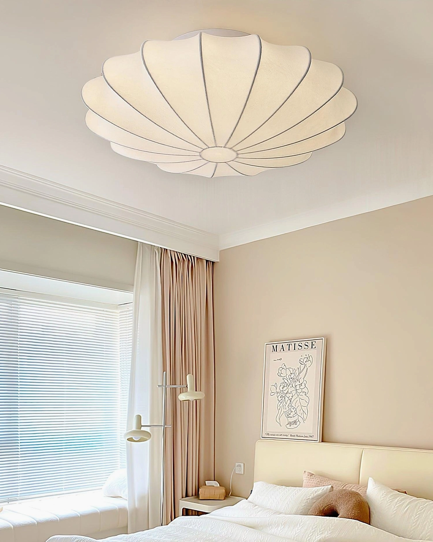 Contemporary bubble ceiling light as wall sconce in cozy bedroom with bay window warm glow
