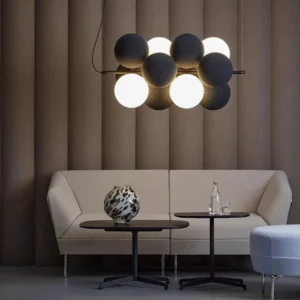 Overhead view of bubble pendant light installed in contemporary living room with black dark brown and off-white spheres